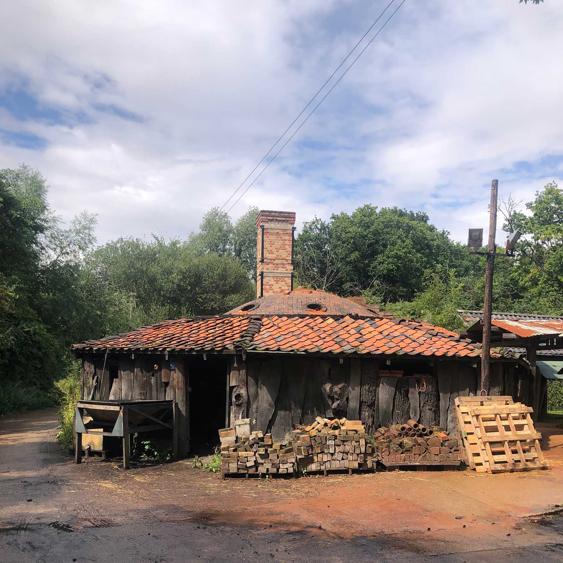 a single storey round structure with a chimney