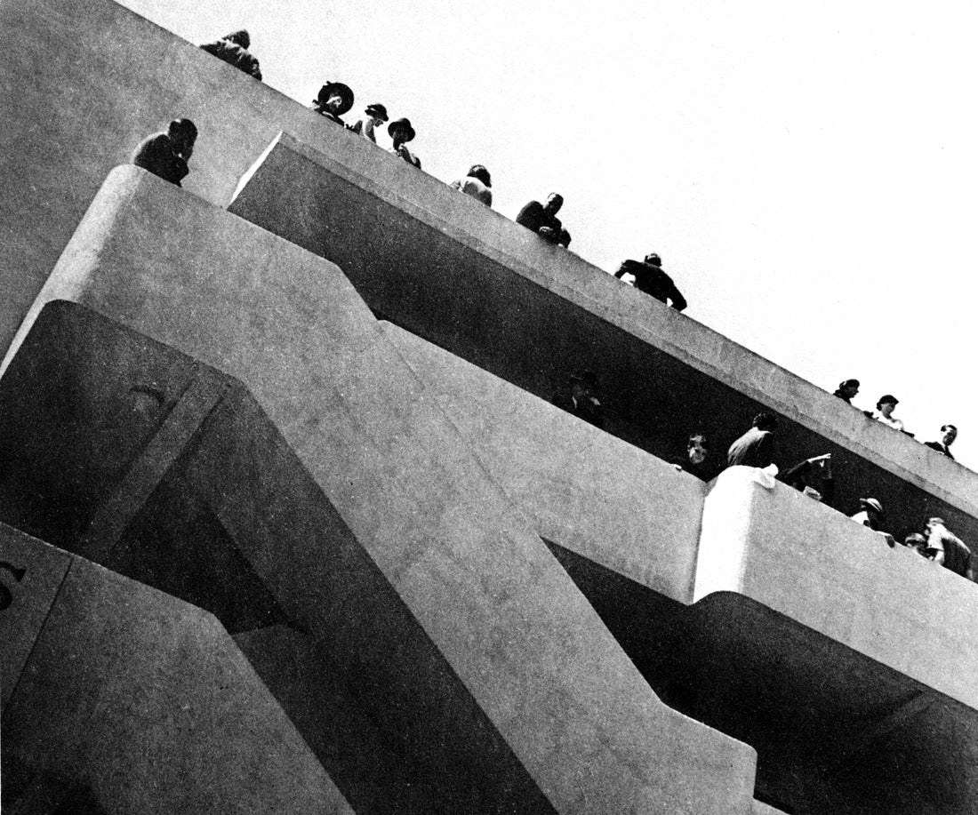 a black and white photo of people at the isokon building in the 1930s